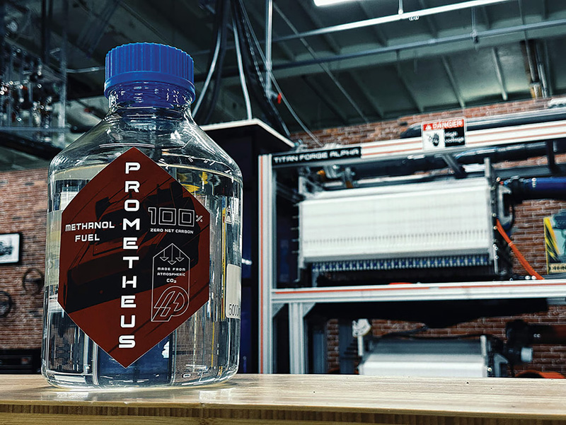 A bottle of clear Prometheus branded net-zero fuel
